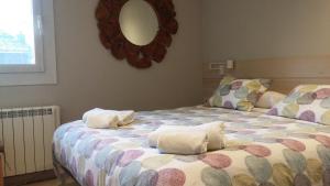 Un ou plusieurs lits dans un hébergement de l'établissement Apartamento GAUSAC