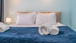 Ένα ή περισσότερα κρεβάτια σε δωμάτιο στο NEW GUDAURI ATRIUM 109 +10 φωτογραφίες