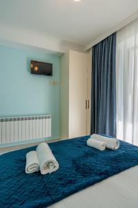 Ένα ή περισσότερα κρεβάτια σε δωμάτιο στο NEW GUDAURI ATRIUM 109