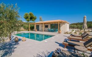 a villa with a swimming pool and a house at Tsilivi Pandessia Villa in Tsilivi