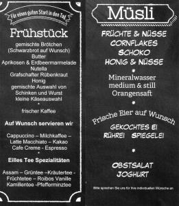 a chalkboard menu for a restaurant withkish food at Zur Ewigen Lampe Romantisches Landhotel & Restaurant in Nideggen