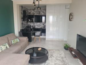 a living room with a couch and a table at Dlalate in Agadir