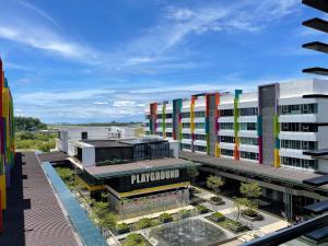 an overhead view of a building with colorful buildings at Aeropod Sovo-Star Suite in Kota Kinabalu