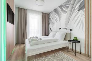 Posteľ alebo postele v izbe v ubytovaní WestSide River Apartment