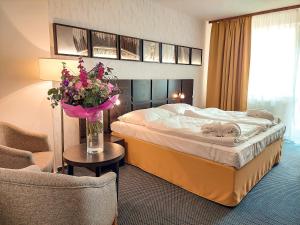 Ένα ή περισσότερα κρεβάτια σε δωμάτιο στο Wellness Hotel Frymburk