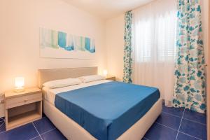 Postel nebo postele na pokoji v ubytování Case Vacanze Torre Lapillo by Porto Cesareo Camping & Village