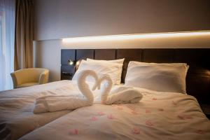Ένα ή περισσότερα κρεβάτια σε δωμάτιο στο Wellness Hotel Frymburk