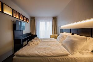 Ένα ή περισσότερα κρεβάτια σε δωμάτιο στο Wellness Hotel Frymburk