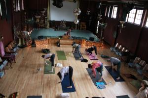 a group of people doing yoga in a room at Royal Nesu Retreat House in Geyserville