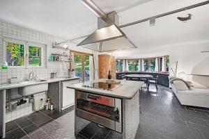 a kitchen with a sink and a counter top at Chesa Alvan - Surlej in Surlej