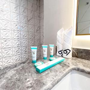 a bathroom counter with two cups and a sink at فندق ليفيل ناين Level Nine Hotel in Jeddah