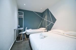 Postel nebo postele na pokoji v ubytování Meta Hotel