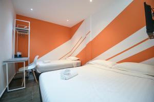 Postel nebo postele na pokoji v ubytování Meta Hotel