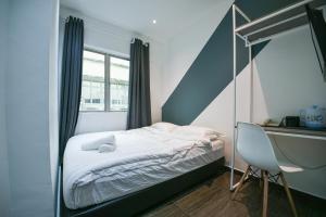 Postel nebo postele na pokoji v ubytování Meta Hotel