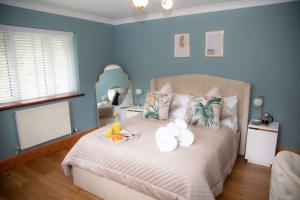 Кровать или кровати в номере Millbrook Lodge