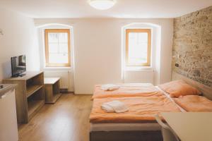 Posteľ alebo postele v izbe v ubytovaní Apartmány Jurica Boží Dar 88