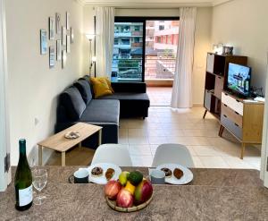 A television and/or entertainment centre at Gecko Apartment with private parking - 1 minutes from the oceanfront!