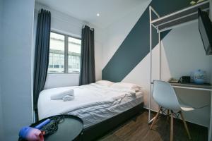 Postel nebo postele na pokoji v ubytování Meta Hotel