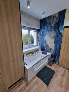 Kúpeľňa v ubytovaní PocztowaResort