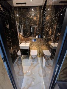 Kúpeľňa v ubytovaní PocztowaResort + 6 fotografií