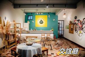 a dining room with a table and chairs at 西湖柚子家民宿 in Xihu