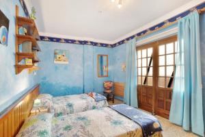 A bed or beds in a room at Villa Petite Paradise