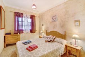 A bed or beds in a room at Villa Petite Paradise