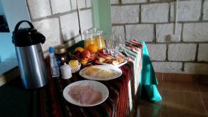 a table with two plates of food on it at Altos del Lascar in Toconao +52 photos