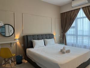 Splendours Condos@Jesselton Quay房間的床