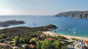 a view of a beach with boats in the water at Pamys House in Kalamitsi