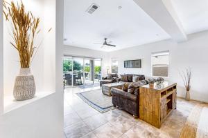 a living room with a couch and a table at Desert Princess Permit# BLIC-000,382-2022 in Cathedral City