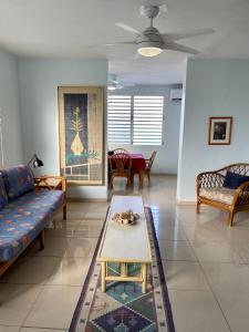 a living room with a couch and a table at Casa Magdalena in San Juan