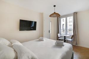 Krevet ili kreveti u jedinici u objektu Pick A Flat's Apartments in Saint-Lazare - Rue de Londres