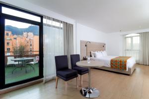 Postel nebo postele na pokoji v ubytování Hotel Rosales Plaza + 37 fotografií