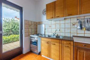 Kuchyň nebo kuchyňský kout v ubytování Apartment Suzy