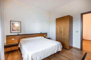 Cama o camas de una habitación en Hotel Nuova Grosseto