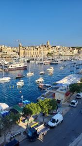 a view of a marina with boats in the water at Entire Senglea Seaview Town house in Senglea