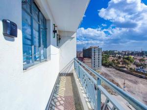 a balcony with a view of a city at LaMeg Furnished Studio in Fedha in Nairobi