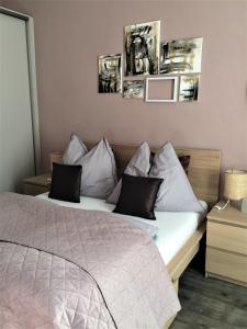 Postel nebo postele na pokoji v ubytování Magnolia Apartman
