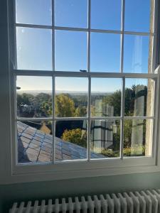 a window with a view of a roof at The Castle Inn Bradford on Avon in Bradford on Avon