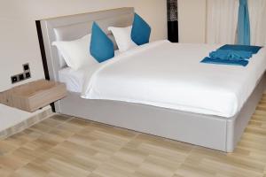 Cama o camas de una habitación en Hôtel Printemps Mont Korhogo