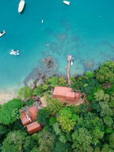 an aerial view of a resort near the water at Casa da Ilha & SPA in Abraão