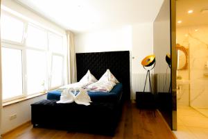 Postel nebo postele na pokoji v ubytování XuBa ApartmentRooms Messe Wien Prater