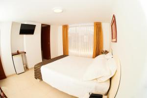 Postel nebo postele na pokoji v ubytování Astorga Hotel Arequipa