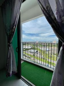 a room with a window with a view of the ocean at Meritus Studio Holiday (Perai) in Perai