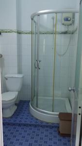 a bathroom with a shower and a toilet at Minh Tai Hotel in Mỹ Tho