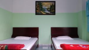 Postel nebo postele na pokoji v ubytování Minh Tai Hotel
