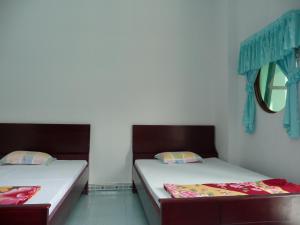 Postel nebo postele na pokoji v ubytování Minh Tai Hotel