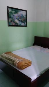 Postel nebo postele na pokoji v ubytování Minh Tai Hotel