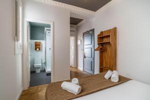 Posteľ alebo postele v izbe v ubytovaní Casa Gracia Apartments